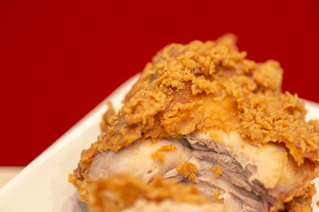 Crispy fried chicken kentucky with red background.