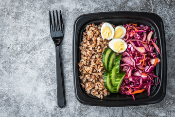 Container with natural healthy vegetarian lunch, food delivery. Copy space.