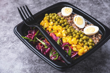 Container with natural healthy vegetarian lunch, food delivery. Close-up.