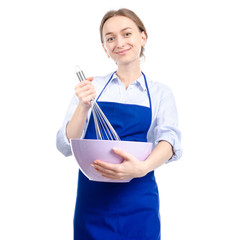 Woman in blue apron with kitchen bowl whisk corolla in hand on white background isolation