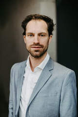 Confident businessman in suit looking into camera