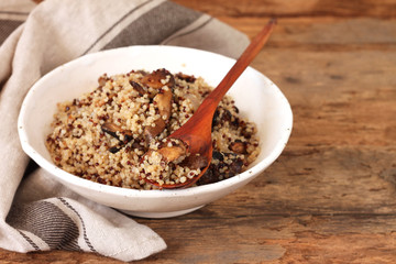 Cooked quinoa in a wooden bowl