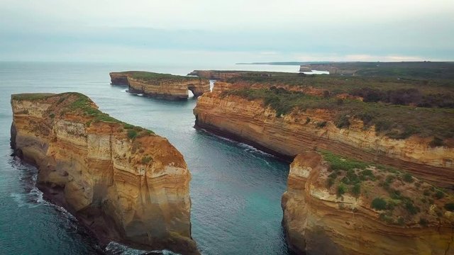 Aerial view of Loch Ard Gorge beach in Twelve Apostles marine park on Shipwreck coast of Victoria, Australia.