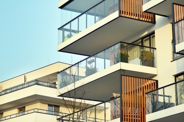 Fototapeta premium Abstract fragment of contemporary architecture, walls made of glass and concrete.