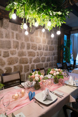 table set and decorated with flowers for a wedding dinner
