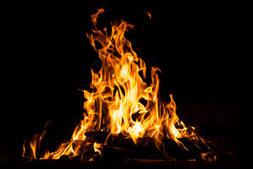 Fire flames burning isolated on black background. High resolution wood fire flames collection smoke texture background concept image.