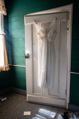 white dress on hanger window light