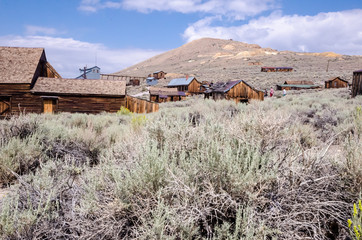 Buildings in the abandoned ghost town of Bodie California. Bodie was a busy, high elevation gold mining town in the Sierra Nevada Mountains in the early 1900s