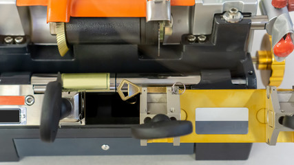 Locksmith duplicate machine make new key.