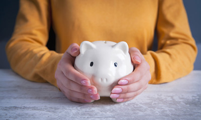 businesswoman and piggy bank