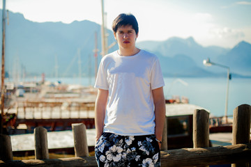 Young man near sea at vacation in summer