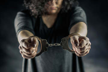 women handcuffed in criminal concept 