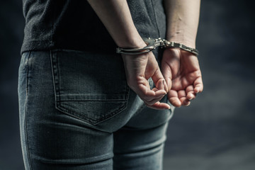 women handcuffed in criminal concept 
