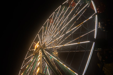 Ferris wheel at the amusement park, night illumination