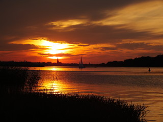 Fototapeta na wymiar Colorful sunset over Schwerin lake