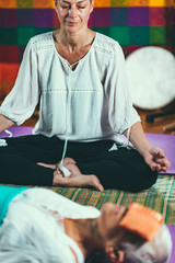 Senior woman on a guided meditation class