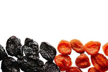 Dried plum - prunes and dried apricot isolated on a white background with copy space for your text. Healthy breakfast. proper nutrition. Top view. Flat lay