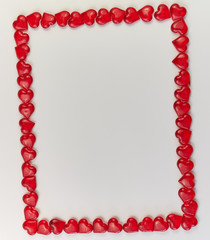 frame lined from small red hearts on a white background. Valentine's Day. Love symbol. copy space