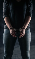 women handcuffed in criminal concept 