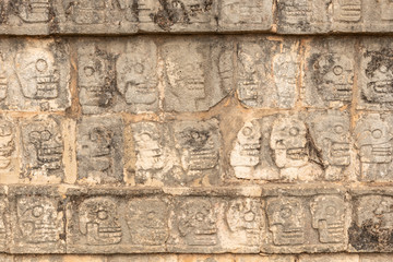 Row of skulls from the sacrificed people in Chichen Itza. Engraving of all the people whose heart was been offered to deities in Mexico