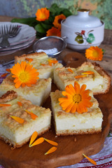 Fototapeta na wymiar Cottage cheese pie. Homemade baking. Rustic grated cake bars on a wooden board.