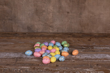 colored easter eggs on a wooden rustic table