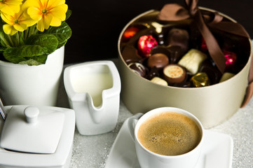Cup of coffee and chocolates