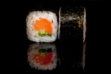 Japanese national popular cuisine. Sushi, rice and fish. Tasty, beautifully served food in a restaurant, cafe, with elements of the original design