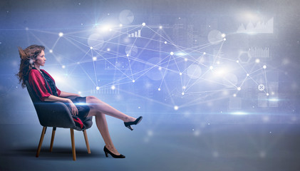 Elegant woman sitting in a sofa with network and connection concept
