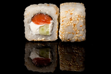 Japanese national popular cuisine. Sushi, rice and fish. Tasty, beautifully served food in a restaurant, cafe, with elements of the original design