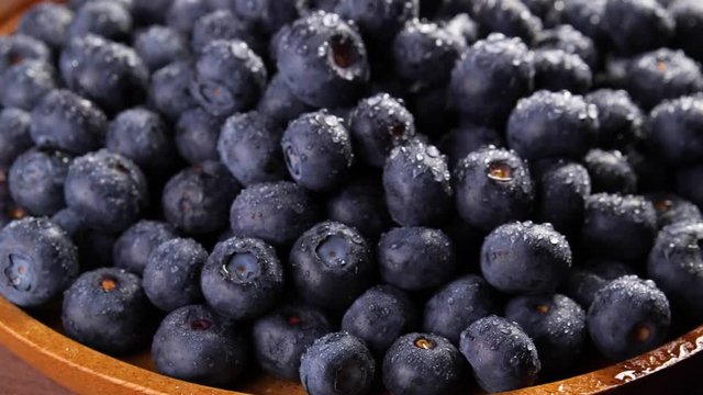 Heap of fresh blueberries rotating. Closeup macro shot. Fresh berry series. 4k.