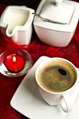 Coffee cup on red background.