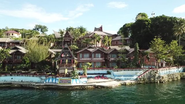 Drone view of lakeside resort on Samosir island in Lake Toba, Sumatra, Indonesia.