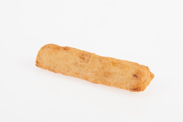 tasty fried yucca sticks on white background
