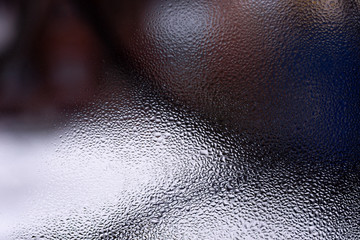 Water drops on glass window close up with blurred background. Drops in macro. Condensate on window...