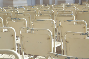 Rows of white chairs from the back