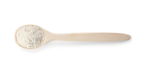 Spoon of oat flour isolated on white, top view
