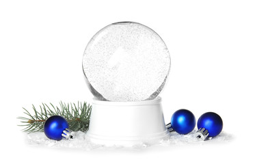 Magical empty snow globe with pine branch and Christmas balls on white background