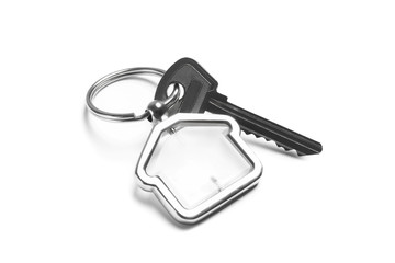 House key with trinket on white background