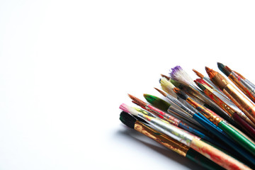Fototapeta premium Different paint brushes on white background. Space for text