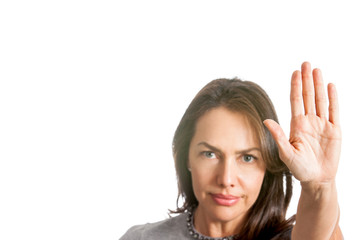 Woman with outstretched hand showing stop gesture isolated on white background