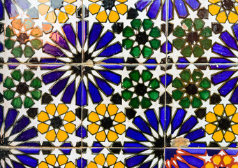 Old wall decorated with beautiful mosaics in Marrakech, Morocco