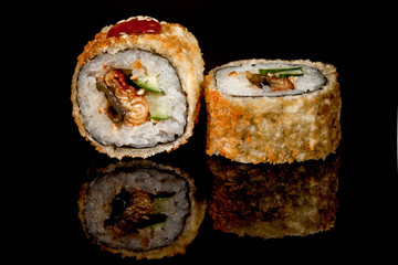 Japanese national popular cuisine. Sushi, rice and fish. Tasty, beautifully served food in a restaurant, cafe, with elements of the original design