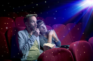 Lovely couple watching 3D movie with little sparkling stars around