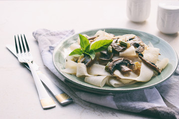 Pasta fetuchini from radish radish with mushrooms and basil. Italian AIP breakfast, dinner or lunch. Autoimmune Paleo. Diet healthy food concept. Cereals Gluten Dairy free. Copy space.