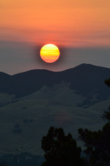 Fiery sunrise obscured by smoke from California fires