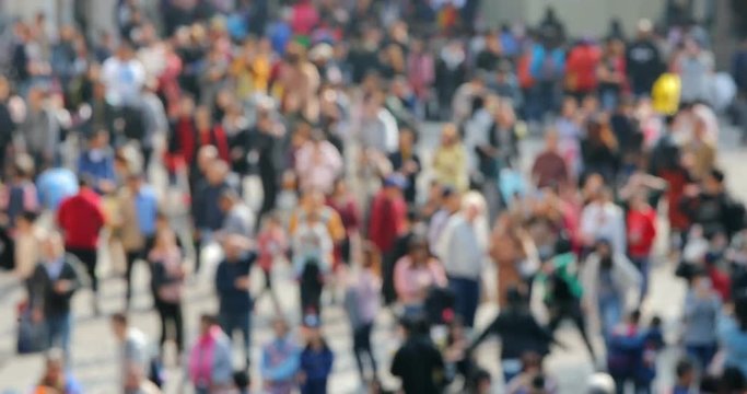 Blur of people walk in the street