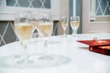 glasses of champagne on a white table