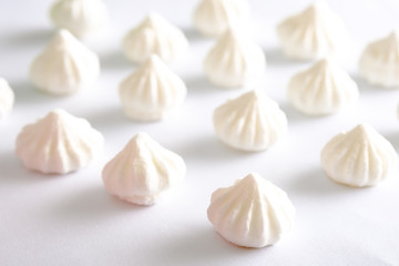 meringue cake white on a white background side view