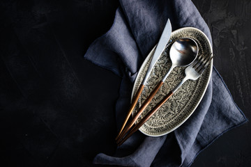 Cutlery set on rustic background